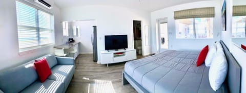 Exclusive Studio Suite, 1 King Bed, Kitchenette, Beach View | Select Comfort beds, individually furnished, iron/ironing board