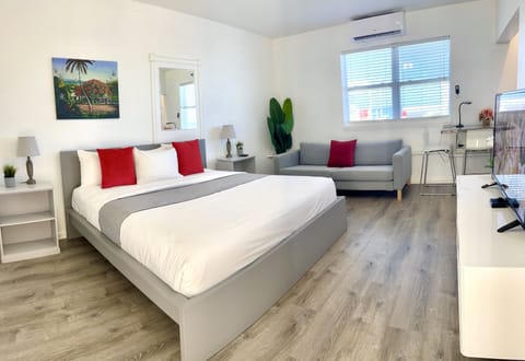 Exclusive Studio Suite, 1 King Bed, Kitchenette, Beach View | Select Comfort beds, individually furnished, iron/ironing board