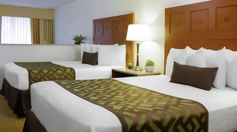 Deluxe Suite, 2 Queen Beds, Jetted Tub | In-room safe, desk, blackout drapes, iron/ironing board