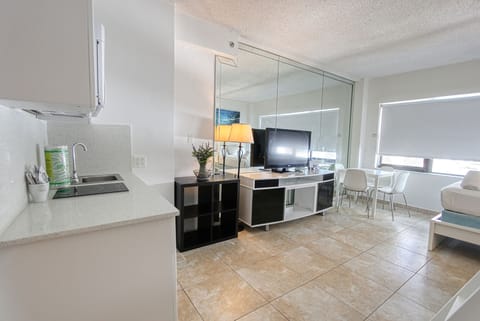 Premium Studio, 2 Double Beds, Partial Ocean View | Living room | 40-inch flat-screen TV with cable channels, TV