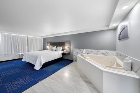 Suite, 1 King Bed, Jetted Tub (Smoke Free) | In-room safe, desk, laptop workspace, blackout drapes