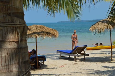 On the beach, sun loungers, beach umbrellas, beach volleyball