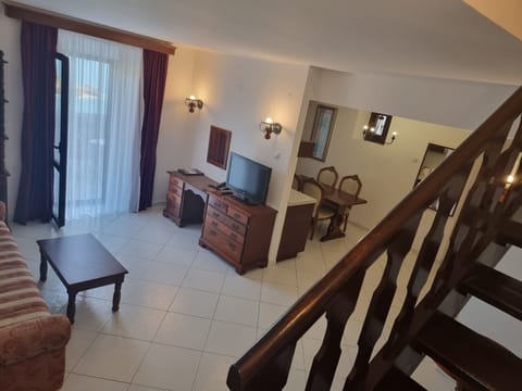 Deluxe Suite, 2 Bedrooms, Terrace, Sea View | Living area | 32-inch TV with cable channels