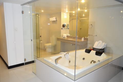 Luxury Suite, 1 King Bed, Pool View | Bathroom | Shower, rainfall showerhead, designer toiletries, hair dryer