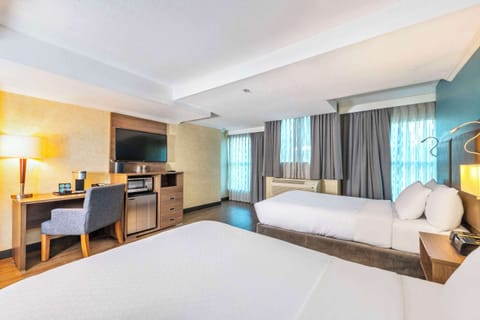 Standard Room, 2 Queen Beds, Non Smoking | In-room safe, desk, laptop workspace, blackout drapes