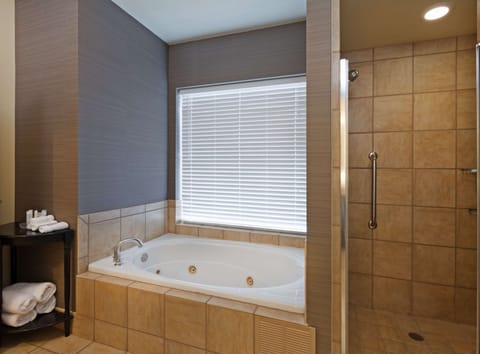 Suite, 1 King Bed, Fireplace | Bathroom | Free toiletries, hair dryer, towels