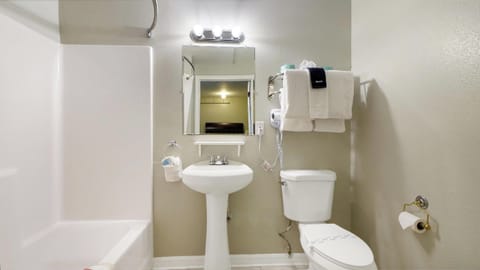 Classic Room, 2 Queen Beds | Bathroom | Combined shower/tub, free toiletries, hair dryer, towels