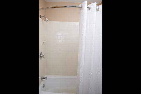 Standard Room, 2 Queen Beds, Non Smoking | Bathroom | Combined shower/tub, free toiletries, hair dryer, towels