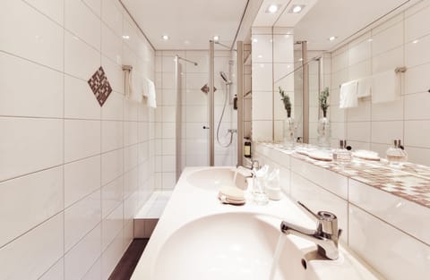 Family Room | Bathroom | Shower, designer toiletries, hair dryer, towels