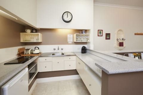 Foreshore Apartment 106 at 81 Proudlove Parade | Private kitchen | Mini-fridge, microwave, stovetop, coffee/tea maker