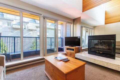 Condo, 1 Bedroom + Loft, Hot Tub (Unit 205) | Living area | Flat-screen TV, fireplace