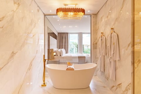 Romantic Suite, Bathtub, Resort View | Bathroom | Shower, hair dryer, towels