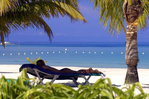 On the beach, sun loungers, beach towels