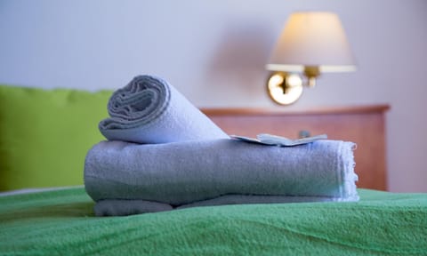 Desk, laptop workspace, blackout drapes, iron/ironing board