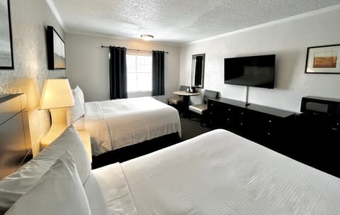 Deluxe Room, 2 Queen Beds (Interior) | In-room safe, iron/ironing board, rollaway beds, bed sheets