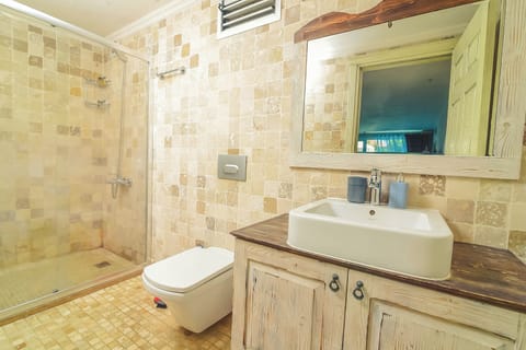 Luxury Quadruple Room, Pool View | Bathroom | Shower, free toiletries, hair dryer, slippers