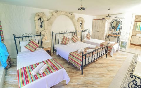 Luxury Quadruple Room, Pool View | Premium bedding, minibar, in-room safe, desk