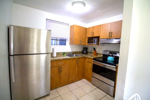 Comfort Apartment, 2 Bedrooms | Private kitchen | Full-size fridge, microwave, stovetop, dishwasher