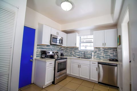 Apartment, 4 Bedrooms | Private kitchen | Full-size fridge, microwave, stovetop, coffee/tea maker