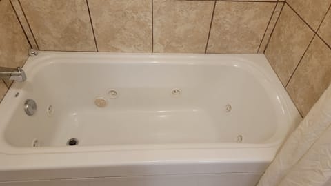 Jetted Tub, 2 Queen Beds | Bathroom | Free toiletries, hair dryer, towels, soap