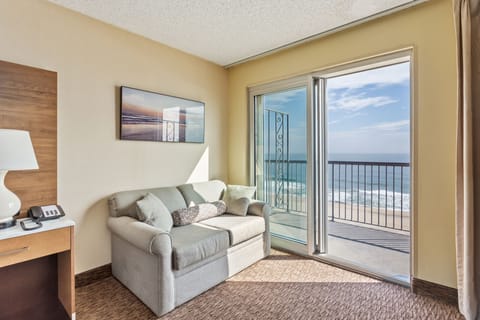 Oceanfront Room, 1 King Bed, Jetted Tub & 75'' TV | Living area | 39-inch flat-screen TV with cable channels, TV