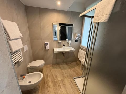 Shower, free toiletries, hair dryer, slippers