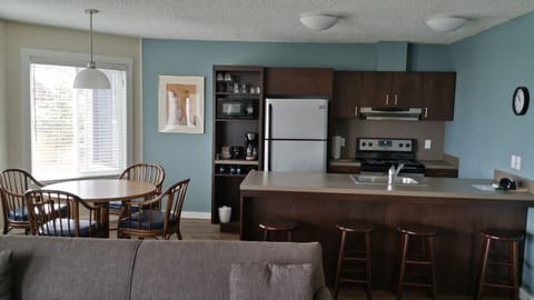 Family Suite, 2 Bedrooms, Fireplace, Beach View | Private kitchen | Fridge, microwave, coffee/tea maker, dining tables