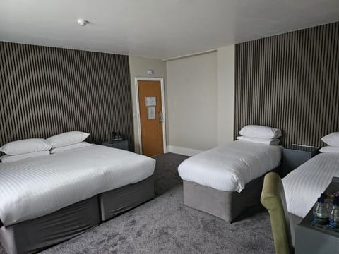 Family Room | Hypo-allergenic bedding, desk, laptop workspace, blackout drapes