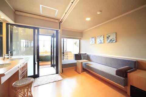 Japanese Style Room with Private Open-air Bath, City View | Living area | Flat-screen TV