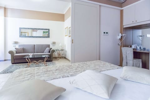 Family Room | Minibar, in-room safe, desk, iron/ironing board