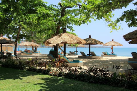 On the beach, white sand, free beach cabanas, sun loungers