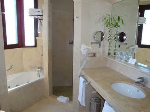 Bathtub, jetted tub, designer toiletries, hair dryer