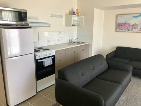 Three  Bedroom Apartment | Private kitchen | Fridge, microwave, coffee/tea maker, electric kettle