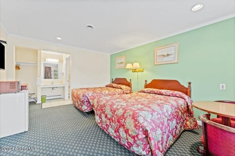 Room, 2 Double Beds | Individually decorated, individually furnished, desk, blackout drapes