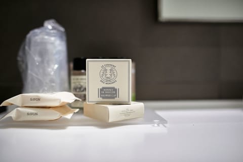 Designer toiletries, hair dryer, slippers, bidet