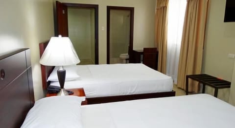 Twin Room, 2 Double Beds | In-room safe, desk, free WiFi, bed sheets