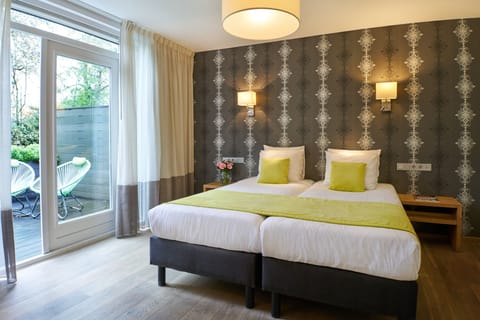 Deluxe Double Room, 1 Queen Bed, Terrace (Ground Floor) | Down comforters, in-room safe, desk, soundproofing