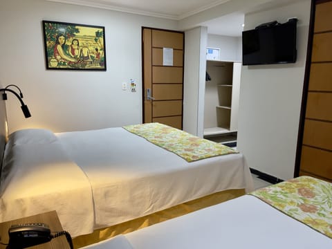 Standard Triple Room | Minibar, in-room safe, individually decorated, individually furnished