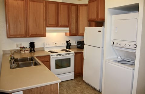 Suite, 2 Queen Beds | Private kitchen | Full-size fridge, microwave, oven, stovetop