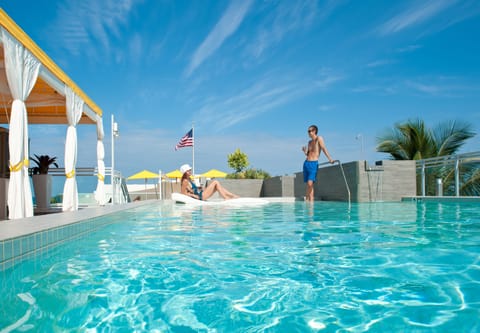 Outdoor pool, open 8:00 AM to 7:00 PM, free cabanas, pool umbrellas