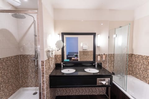 Suite, 1 King Bed | Bathroom | Eco-friendly toiletries, hair dryer, towels