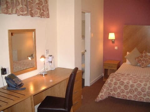 Standard Double Room | Pillowtop beds, individually decorated, desk, iron/ironing board