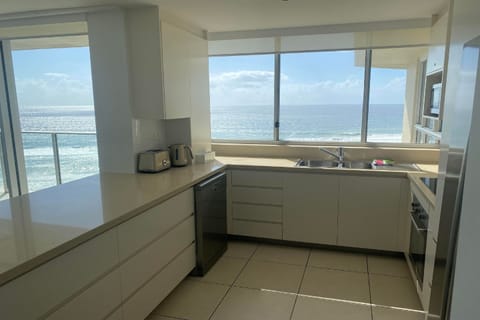 Apartment, 2 Bedrooms (Absolute Beach Front) | Private kitchen | Full-size fridge, microwave, oven, stovetop