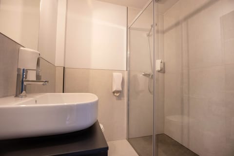 Double Room | Bathroom | Shower, towels, soap, shampoo