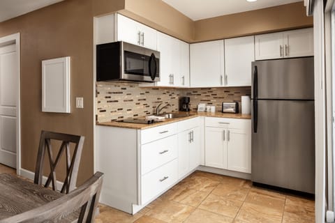 Suite, 1 Queen Bed, Non Smoking, Balcony | Private kitchen | Full-size fridge, microwave, stovetop, dishwasher