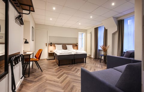 Standard Quadruple Room, Private Bathroom (Single Beds) | Desk, iron/ironing board, free WiFi, bed sheets