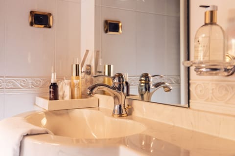 Suite (Sun) | Bathroom | Designer toiletries, hair dryer, bathrobes, slippers