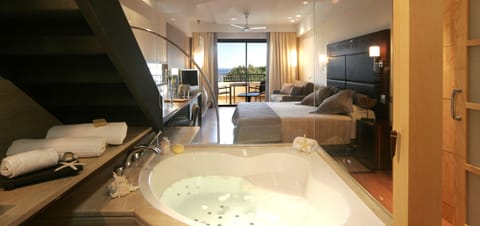 Junior Suite, Jetted Tub (Prestige Solarium) | Bathroom | Combined shower/tub, deep soaking tub, designer toiletries, hair dryer