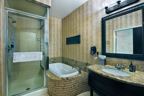 Extended Stay Balcony King Suite Kitchenette | Bathroom | Separate tub and shower, deep soaking tub, free toiletries, hair dryer