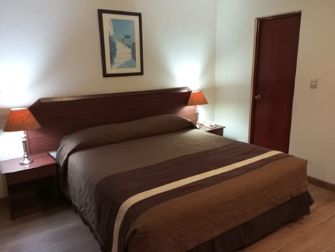 Double Room | Minibar, in-room safe, individually decorated, individually furnished